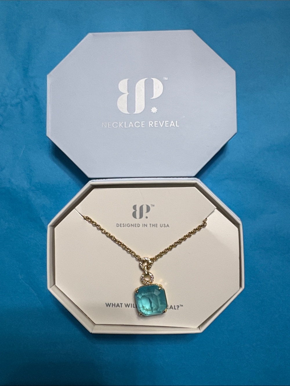 Bomb Party Gold Chain with Aqua Blue Cushion Pendant